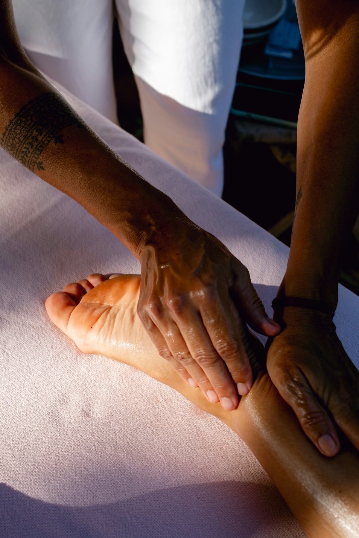 Gentle foot massage as part of a bedtime routine