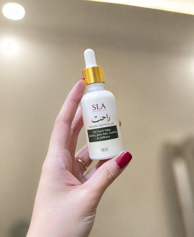 Customer holding a bottle of Rahat Relief Oil