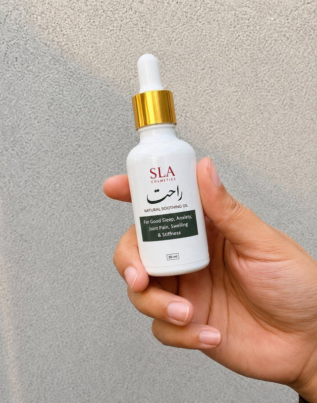 Customer holding a bottle of Rahat Relief Oil