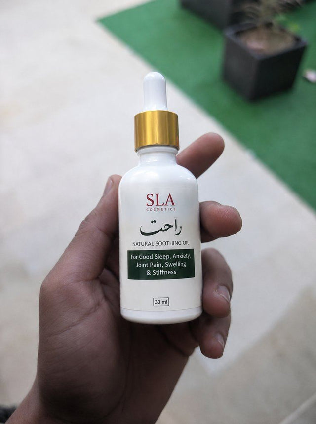 Customer holding a bottle of Rahat Relief Oil