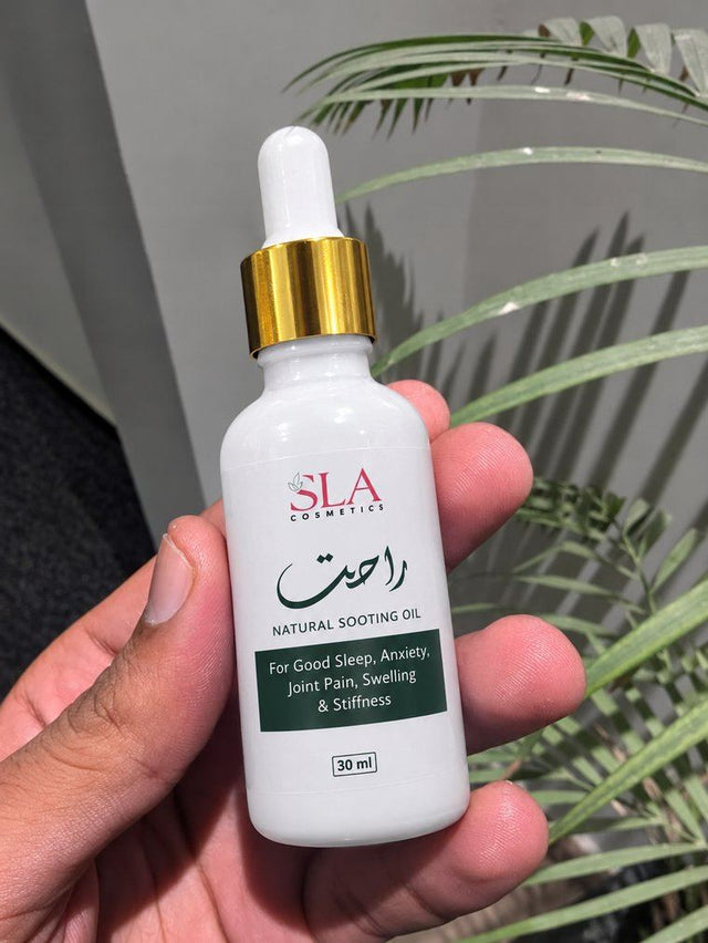 Customer holding a bottle of Rahat Relief Oil